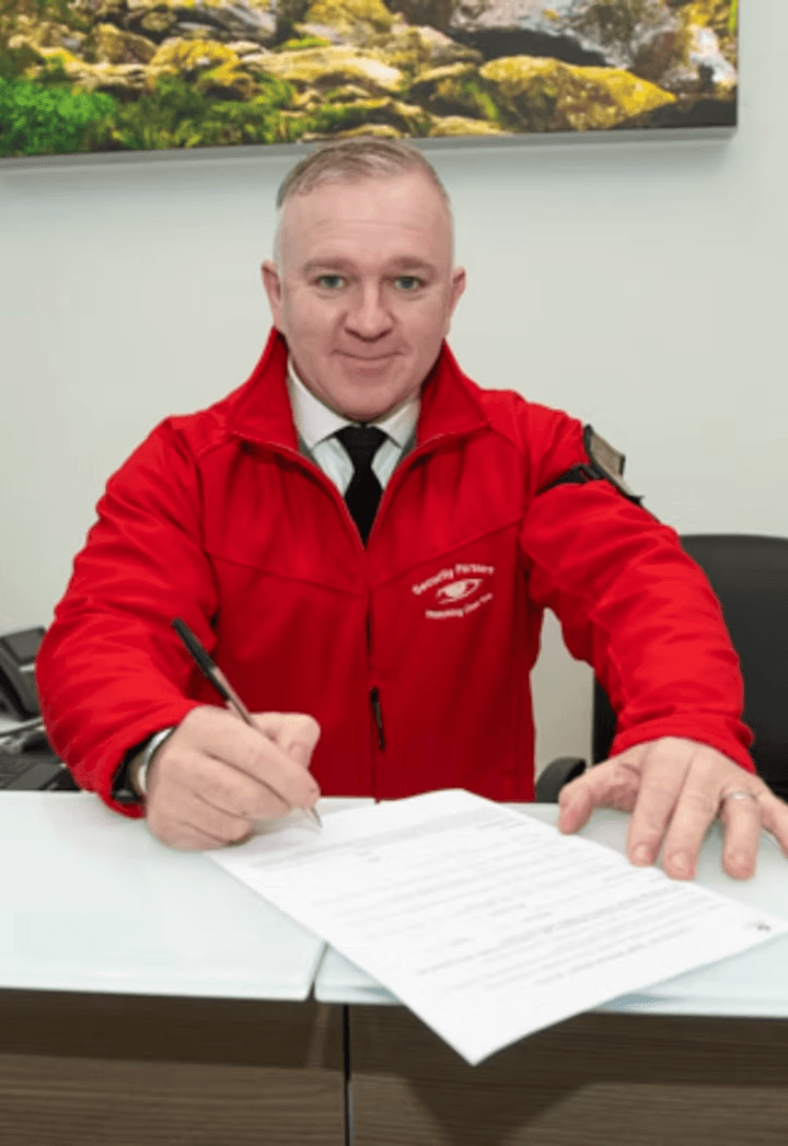 Security Partners officer reviewing paperwork
